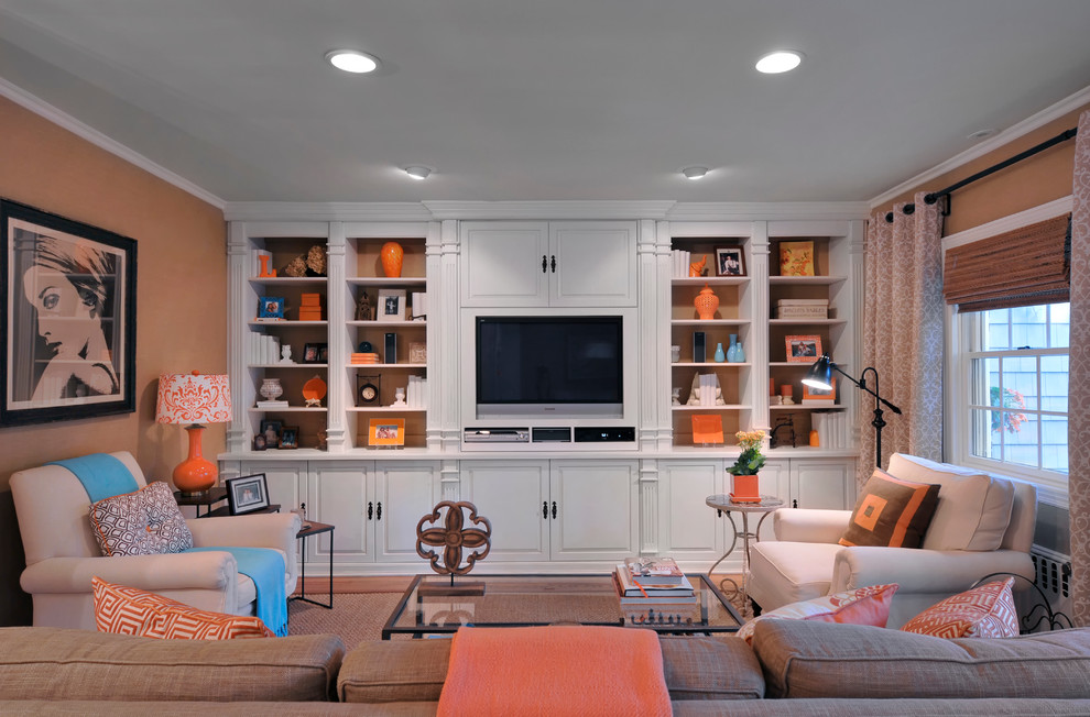 Inspiration for a traditional family room in New York with beige walls and a built-in media wall.