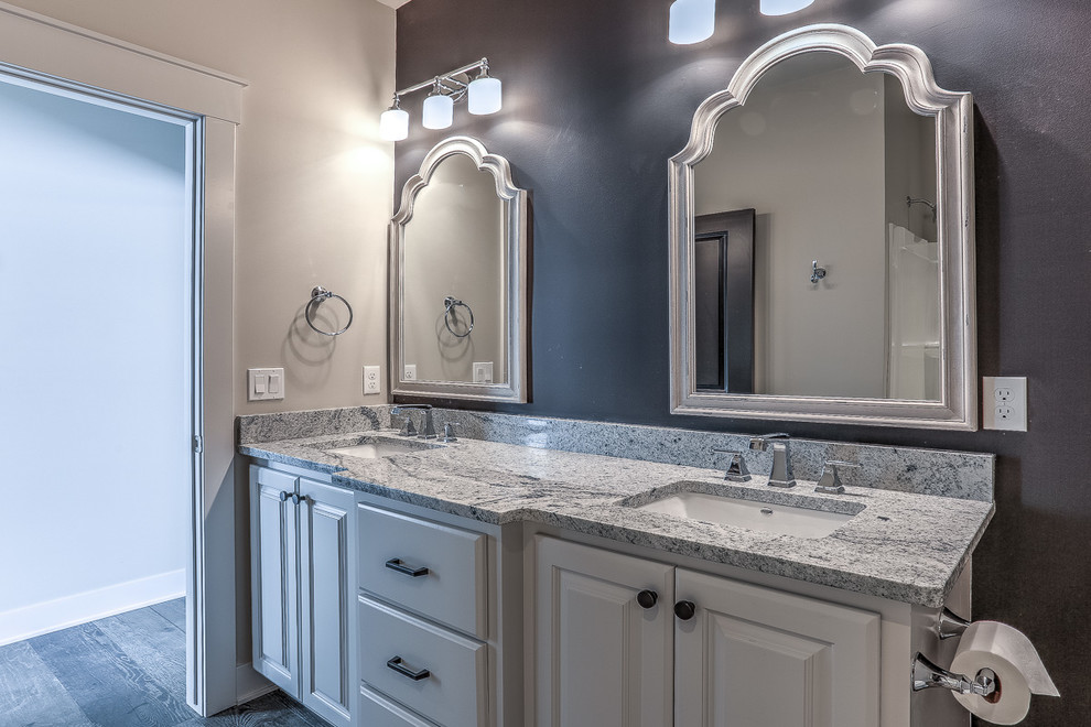 Country kids' ceramic tile and gray floor bathroom photo in Omaha with raised-panel cabinets, white cabinets, a two-piece toilet, gray walls, an undermount sink, granite countertops and gray counterto