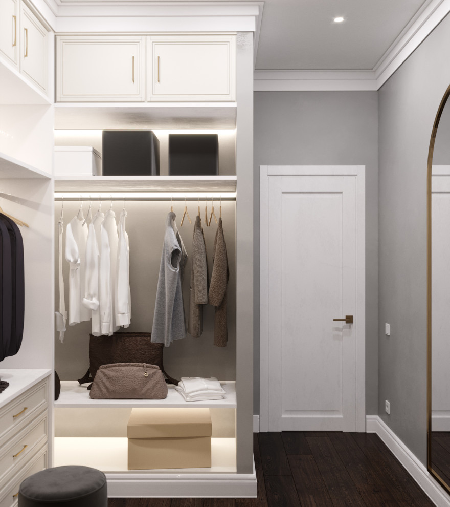 Inspiration for a transitional gender-neutral walk-in wardrobe in Other with raised-panel cabinets.