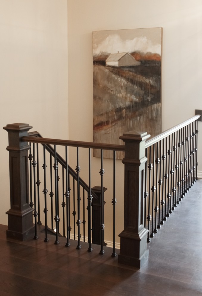 Design ideas for a mid-sized transitional wood u-shaped staircase in Grand Rapids with wood risers.