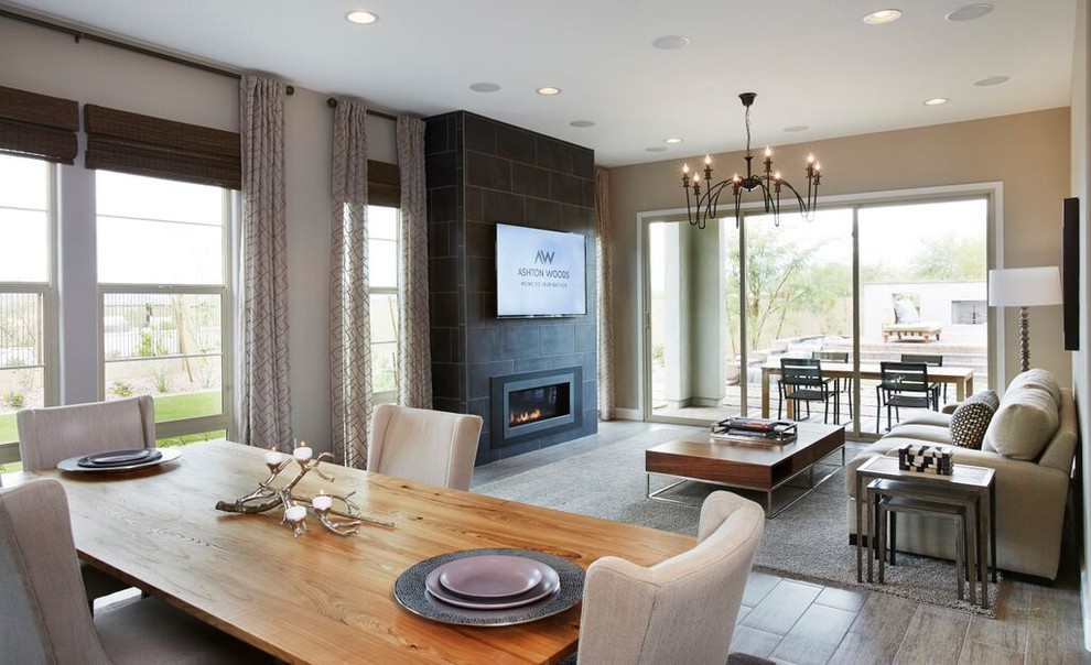 Inspiration for a mid-sized contemporary formal open concept living room in Phoenix with beige walls, light hardwood floors, a standard fireplace, a stone fireplace surround and a wall-mounted tv.