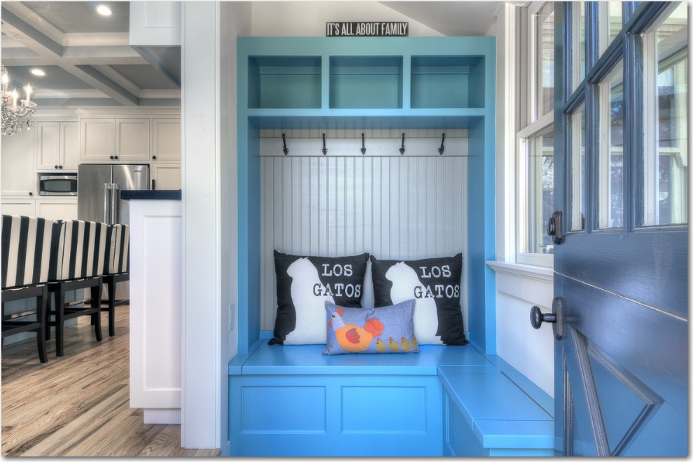 Inspiration for a small transitional mudroom in San Francisco with white walls, light hardwood floors, a blue front door and a dutch front door.