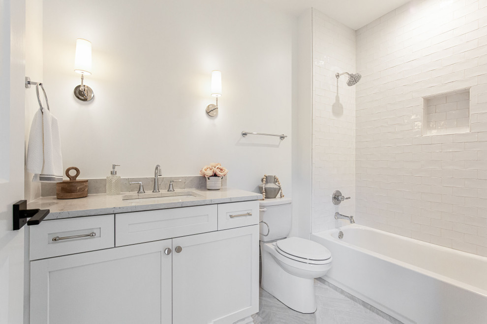 Example of a mid-sized classic kids' gray tile and porcelain tile porcelain tile, gray floor and single-sink bathroom design in Atlanta with shaker cabinets, black cabinets, gray walls, an undermount sink, quartz countertops, a hinged shower door, white countertops and a built-in vanity