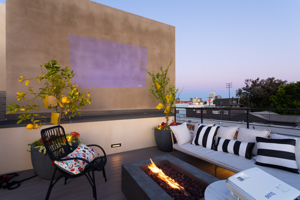 This is an example of a contemporary rooftop deck in Los Angeles with no cover.