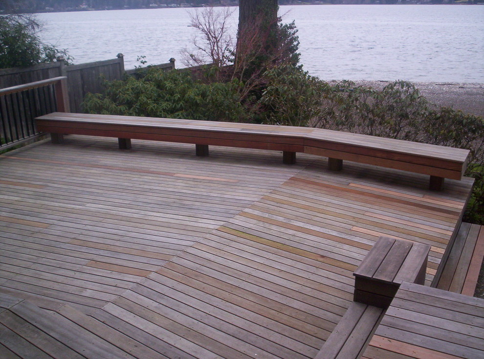 This is an example of a large arts and crafts backyard deck in Seattle with no cover.