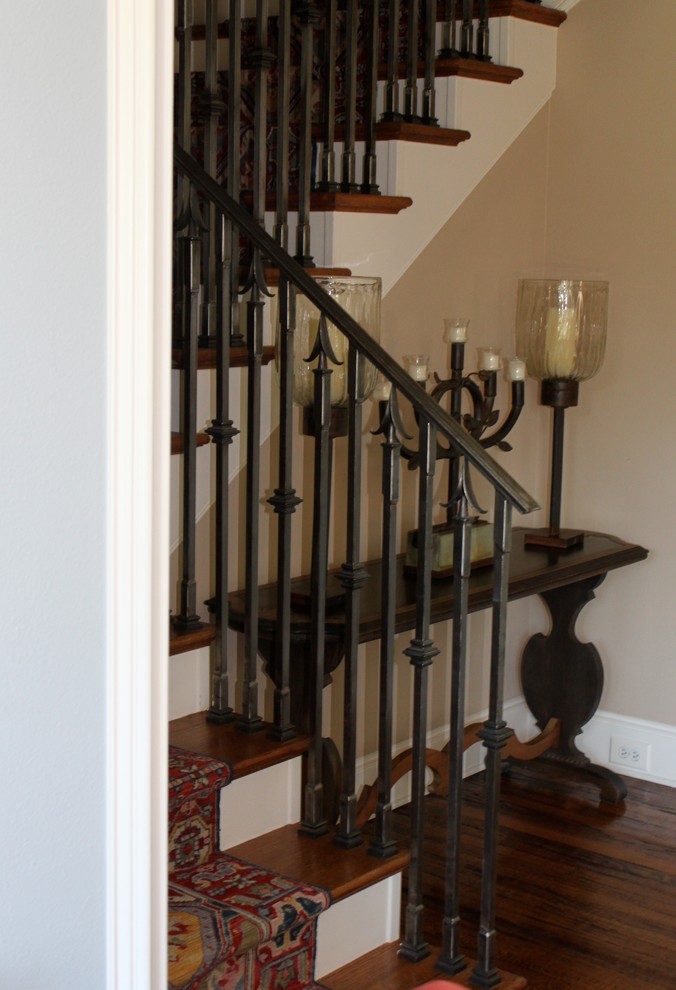 Inspiration for a traditional wood straight staircase in Dallas with painted wood risers.