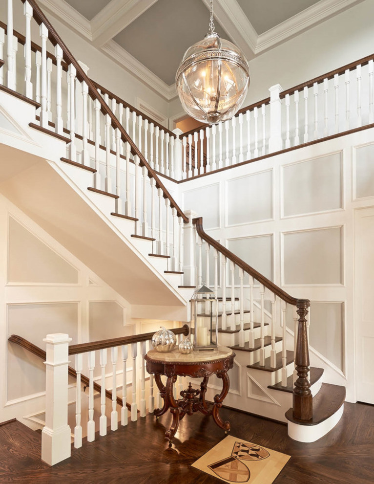 This is an example of a traditional wood l-shaped staircase in Raleigh with painted wood risers.