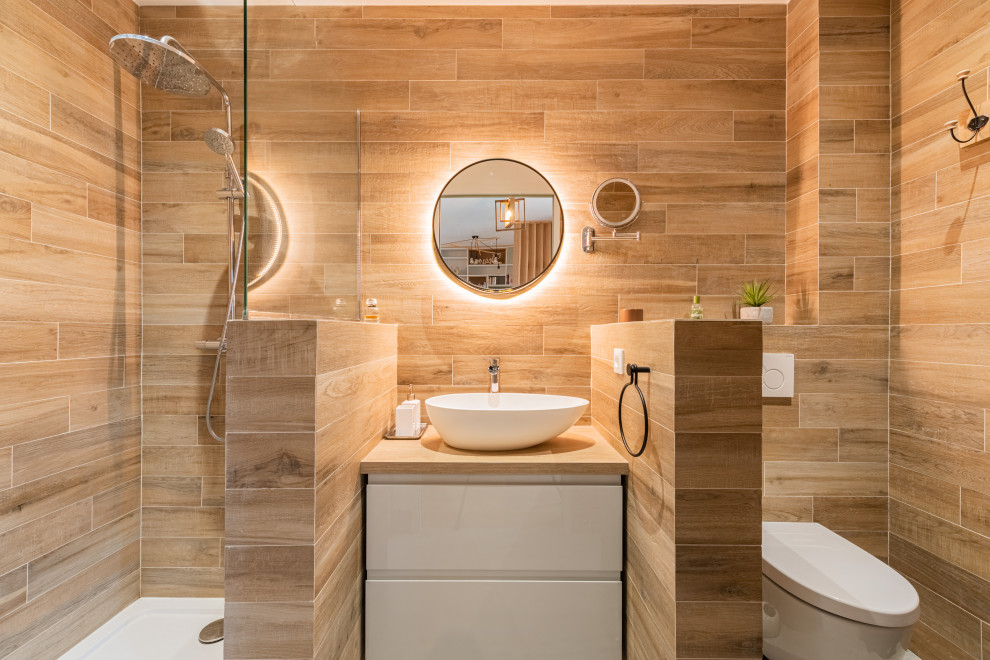 Design ideas for a small contemporary 3/4 bathroom in Paris with flat-panel cabinets, white cabinets, an open shower, a wall-mount toilet, beige tile, wood-look tile, a vessel sink, tile benchtops, grey floor, an open shower, beige benchtops, an enclosed toilet, a single vanity and a floating vanity.