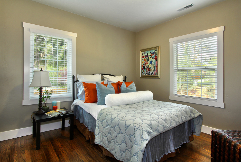 This is an example of a mid-sized contemporary master bedroom in Boise with grey walls and dark hardwood floors.