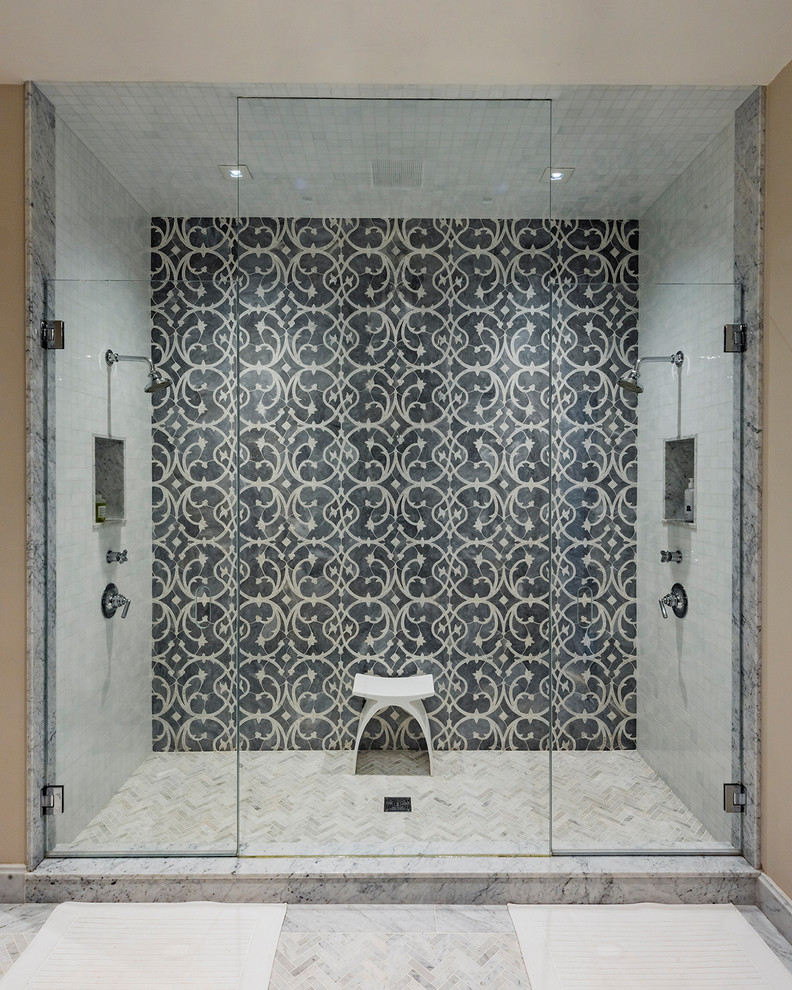 Photo of a transitional bathroom in Boston with an alcove shower, gray tile and white floor.