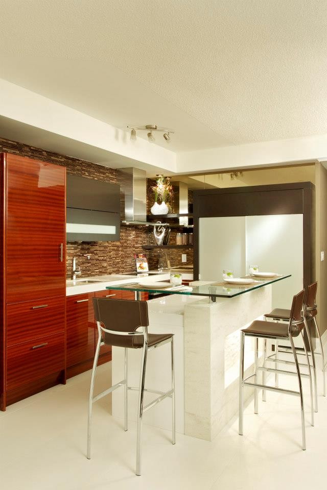 Inspiration for a small contemporary l-shaped eat-in kitchen in Toronto with flat-panel cabinets, medium wood cabinets, quartzite benchtops, with island, an undermount sink, multi-coloured splashback, matchstick tile splashback, panelled appliances and porcelain floors.