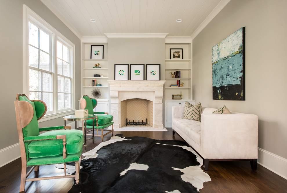 Photo of a transitional formal living room in Atlanta with beige walls, dark hardwood floors and a standard fireplace.