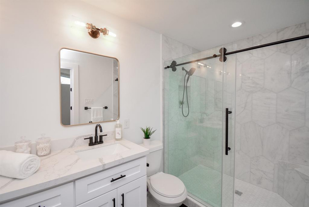 Design ideas for a large contemporary bathroom in Houston with shaker cabinets, white cabinets, a double shower, white tile, laminate floors, marble benchtops, beige floor, a sliding shower screen, white benchtops, a single vanity and coffered.
