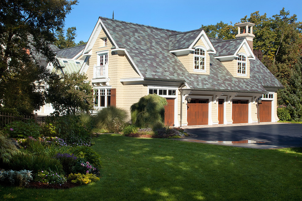 Inspiration for an expansive traditional detached four-car garage in Grand Rapids.