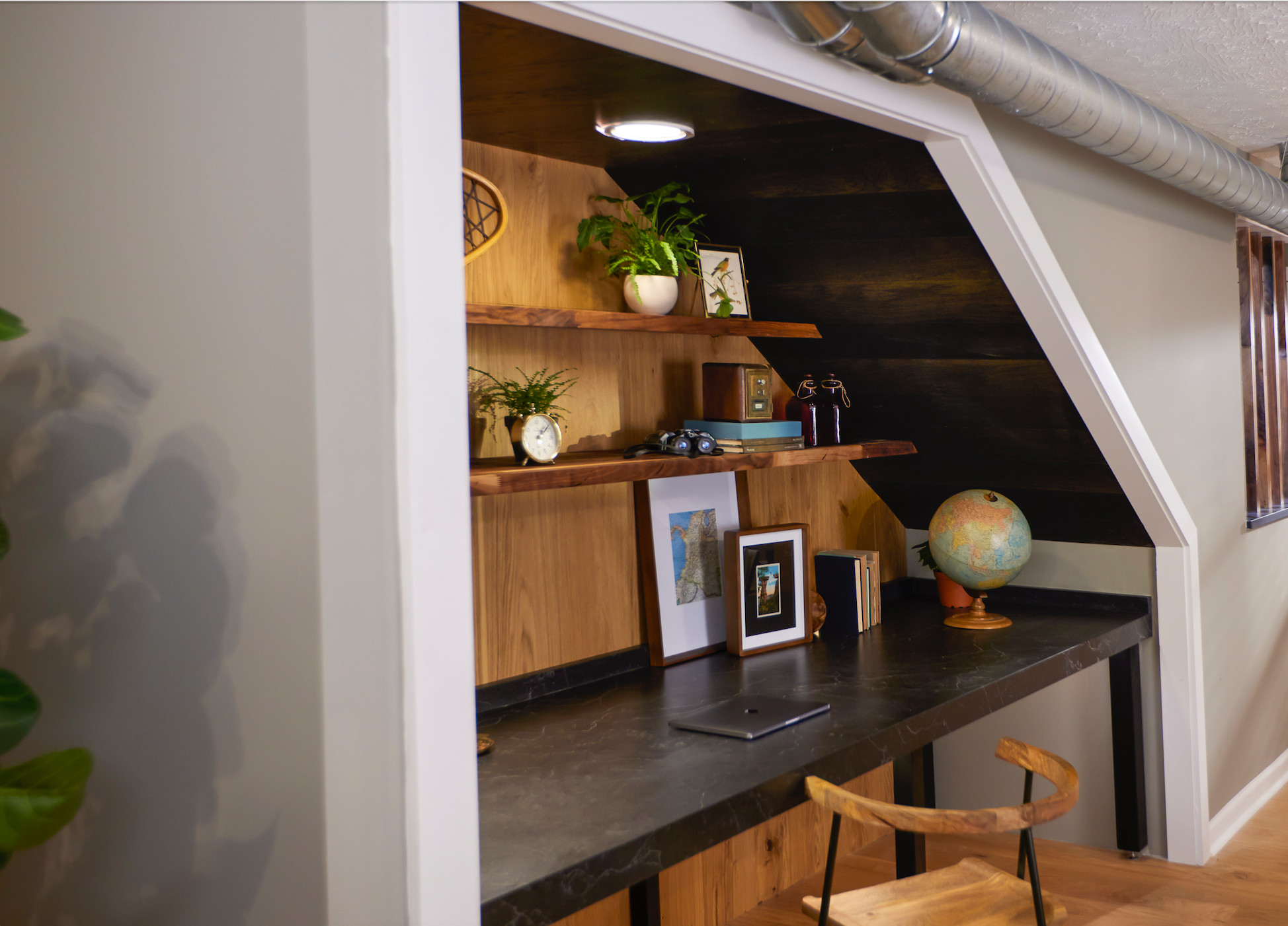 Desk Under Staircase with Exposed Ductwork