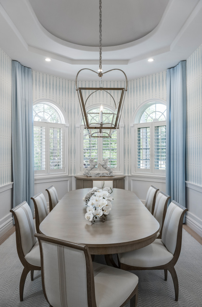 Inspiration for a large transitional light wood floor, beige floor, coffered ceiling and wallpaper kitchen/dining room combo remodel with multicolored walls and no fireplace