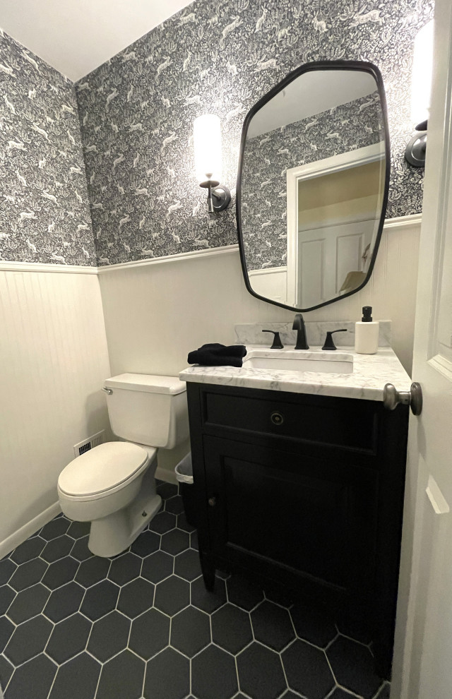This is an example of a small farmhouse cloakroom in Detroit with beaded cabinets, black cabinets, a two-piece toilet, multi-coloured walls, ceramic flooring, a submerged sink, marble worktops, black floors, multi-coloured worktops, a freestanding vanity unit and wainscoting.