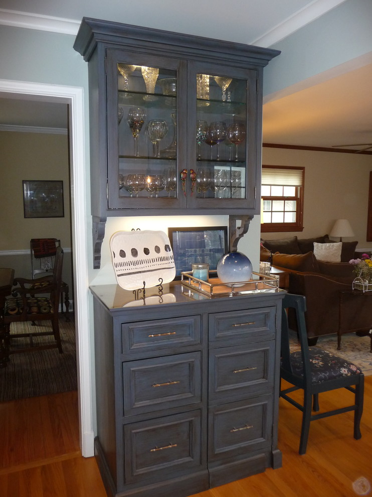 U-shaped light wood floor enclosed kitchen photo in Milwaukee with an undermount sink, glass tile backsplash and stainless steel appliances