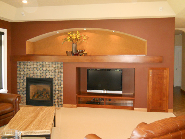 Example of a mid-sized transitional open concept carpeted home design design with multicolored walls, a standard fireplace, a tile fireplace and a media wall