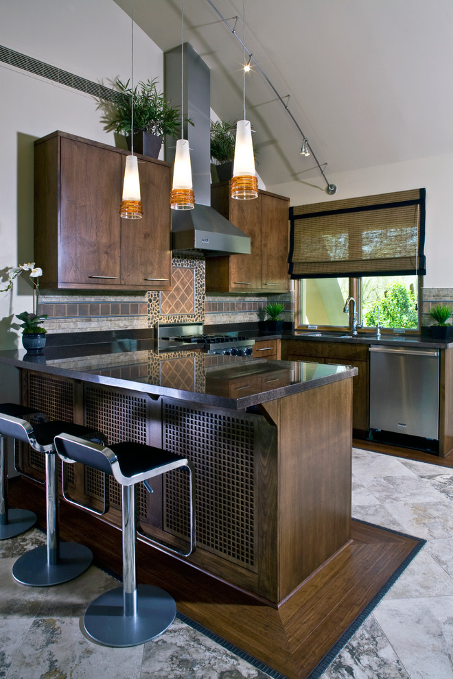 Contemporary u-shaped kitchen in Phoenix with flat-panel cabinets, dark wood cabinets, brown splashback and stainless steel appliances.