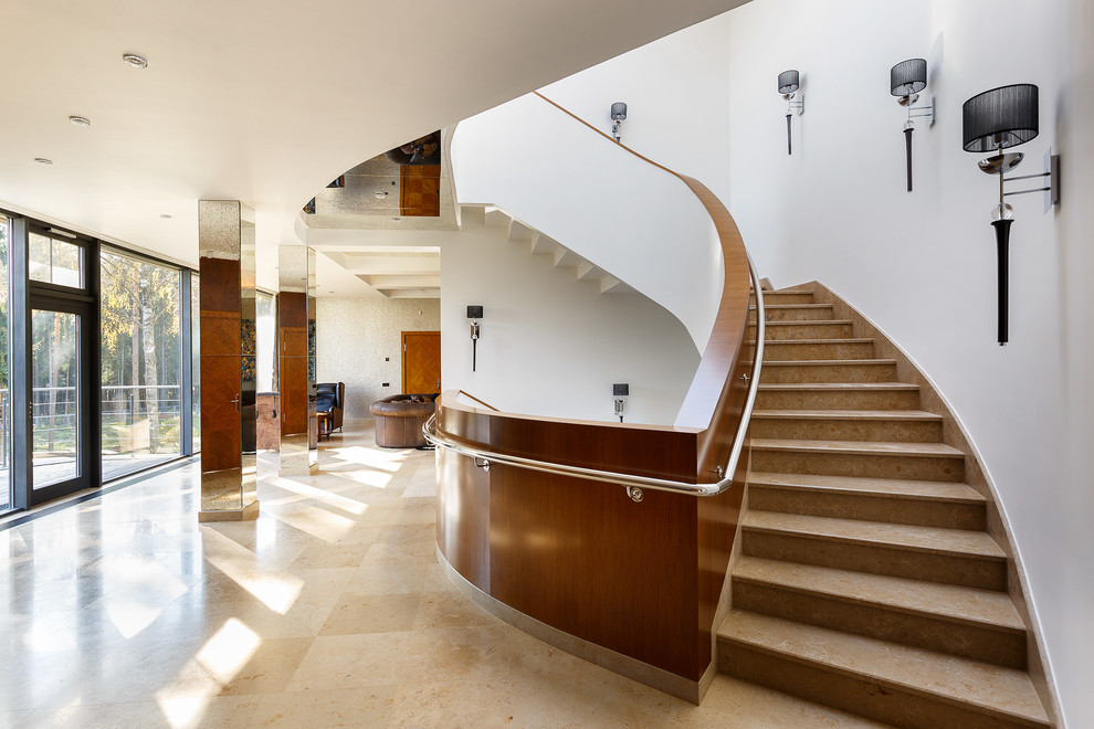 This is an example of a contemporary curved staircase in Saint Petersburg.
