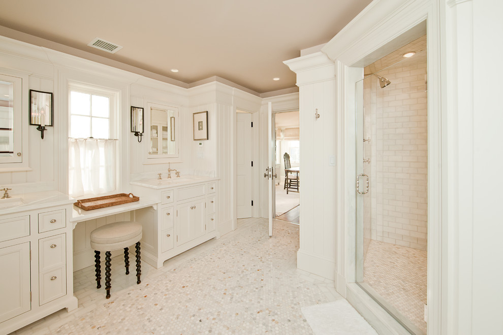 Inspiration for a large traditional master bathroom in Boston with mosaic tile, a console sink, recessed-panel cabinets, white cabinets, a corner shower, white tile, white walls and mosaic tile floors.