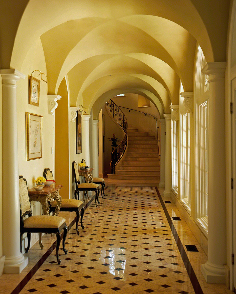 Mediterranean hallway in Little Rock with beige walls and multi-coloured floor.