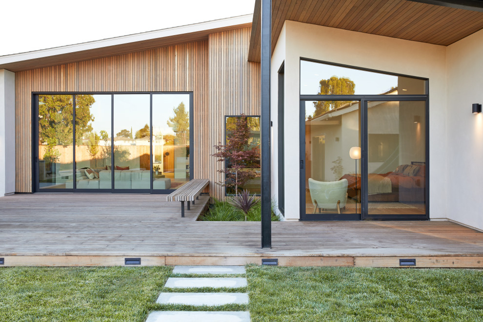 Large modern beige one-story mixed siding gable roof idea in San Francisco with a shingle roof