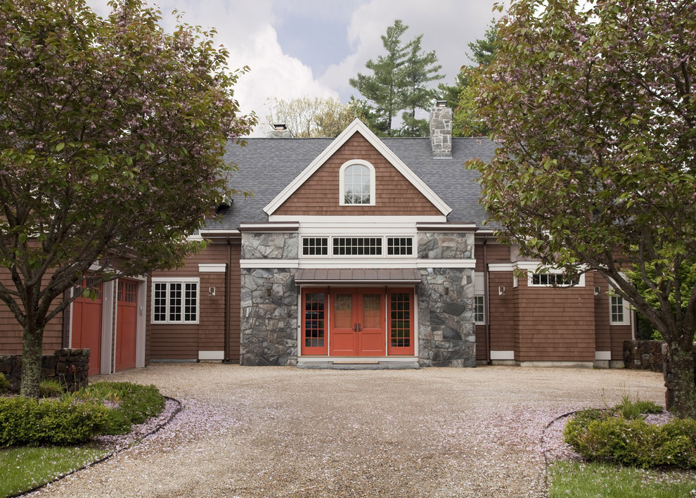 Traditional exterior in Boston with stone veneer and a gable roof.