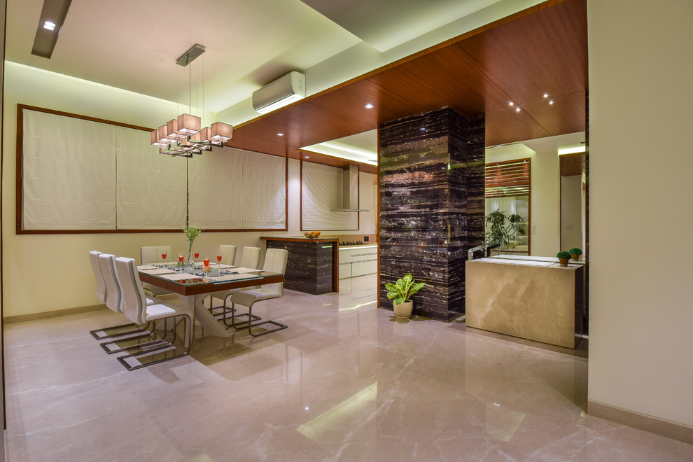 This is an example of a contemporary dining room in Bengaluru.