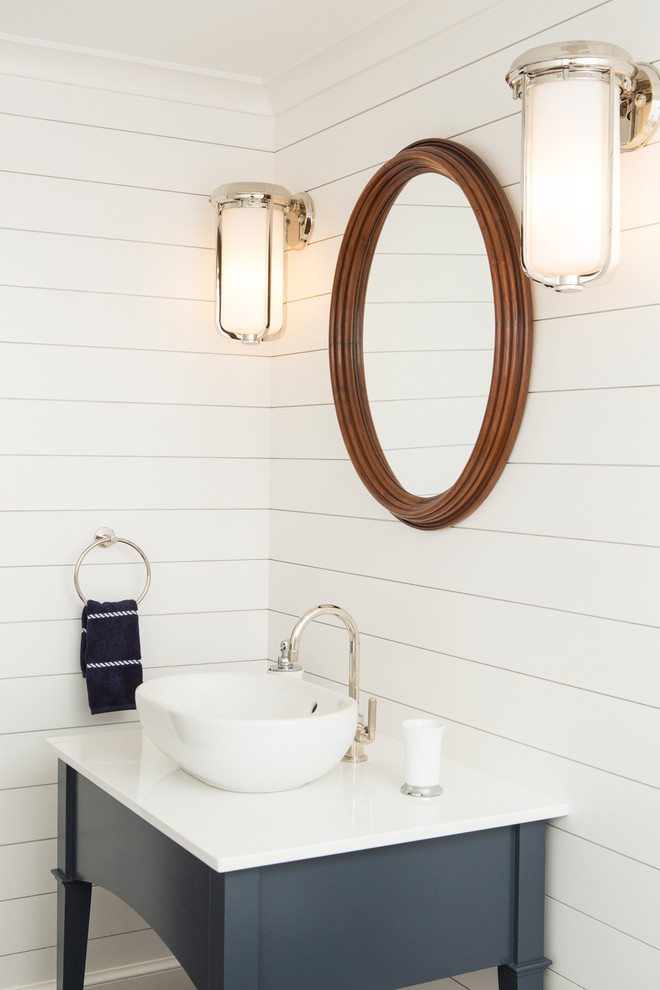 Inspiration for a beach style powder room in Portland Maine with furniture-like cabinets, grey cabinets, white walls, a vessel sink and white benchtops.