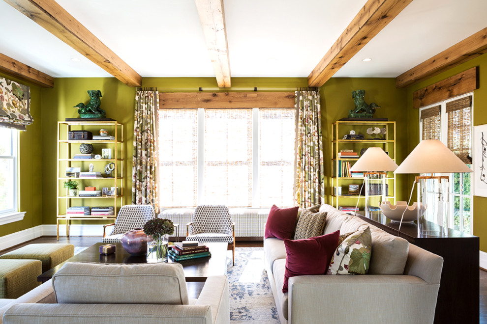 Inspiration for a mid-sized eclectic enclosed family room with green walls, dark hardwood floors, a standard fireplace, a stone fireplace surround, a wall-mounted tv and brown floor.