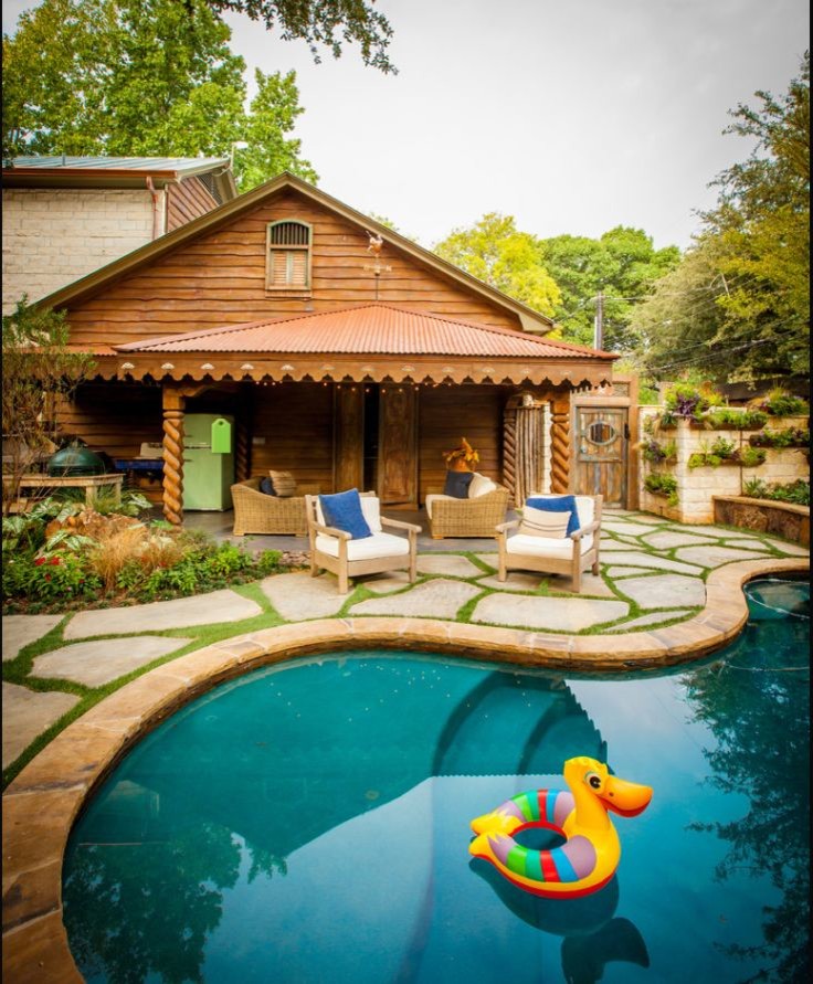 Photo of a small traditional backyard custom-shaped natural pool in Dallas with a hot tub.