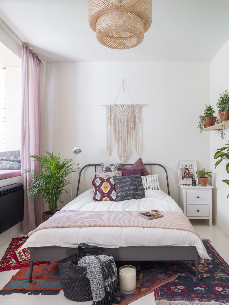 Design ideas for an eclectic master bedroom in Moscow with white walls and white floor.