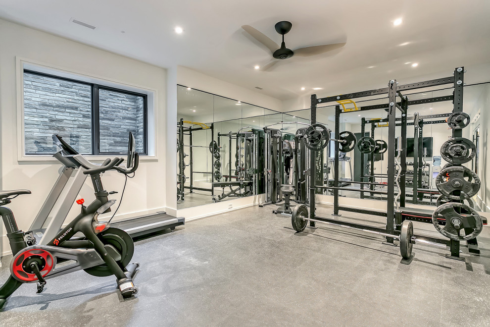 Inspiration for a medium sized contemporary home weight room in Toronto with white walls and grey floors.