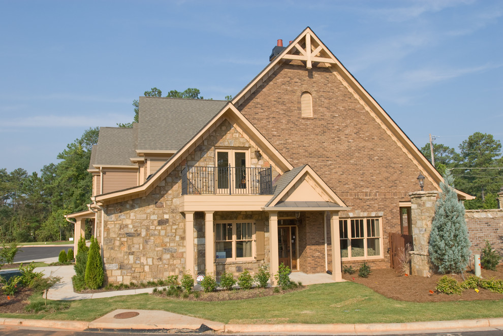 Inspiration for a mid-sized traditional two-storey beige exterior in Atlanta with mixed siding and a gable roof.