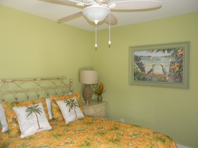 This is an example of a tropical bedroom in Other.