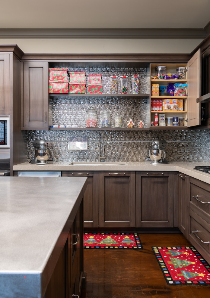 Inspiration for a mid-sized traditional l-shaped separate kitchen in Dallas with an undermount sink, shaker cabinets, medium wood cabinets, stainless steel benchtops, metallic splashback, ceramic splashback, concrete floors, with island and brown floor.