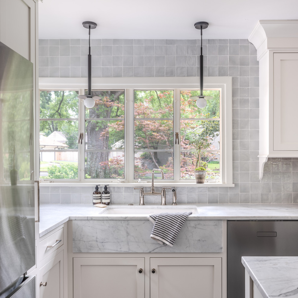 Inspiration for a mid-sized transitional l-shaped cement tile floor and gray floor eat-in kitchen remodel with a drop-in sink, shaker cabinets, white cabinets, quartzite countertops, gray backsplash, porcelain backsplash, stainless steel appliances, an island and multicolored countertops