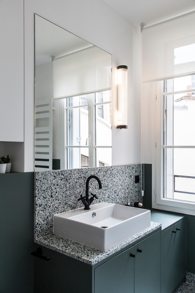 This is an example of a small scandinavian bathroom in Paris with green cabinets, terrazzo floors, terrazzo benchtops, white walls, flat-panel cabinets, multi-coloured tile, a vessel sink, multi-coloured floor and multi-coloured benchtops.