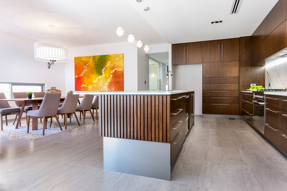 This is an example of a large contemporary galley eat-in kitchen in Perth with an undermount sink, flat-panel cabinets, dark wood cabinets, solid surface benchtops, porcelain splashback, stainless steel appliances, porcelain floors and with island.