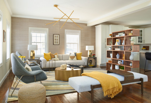 A cozy living room with stylish yellow and gray furniture, white paint colours, creating a modern and vibrant ambiance.
