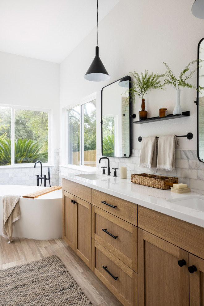 Bathroom - mid-sized transitional master white tile and subway tile vinyl floor and double-sink bathroom idea in Sacramento with recessed-panel cabinets, brown cabinets, white walls, an undermount sink, quartz countertops, a hinged shower door, white countertops and a built-in vanity