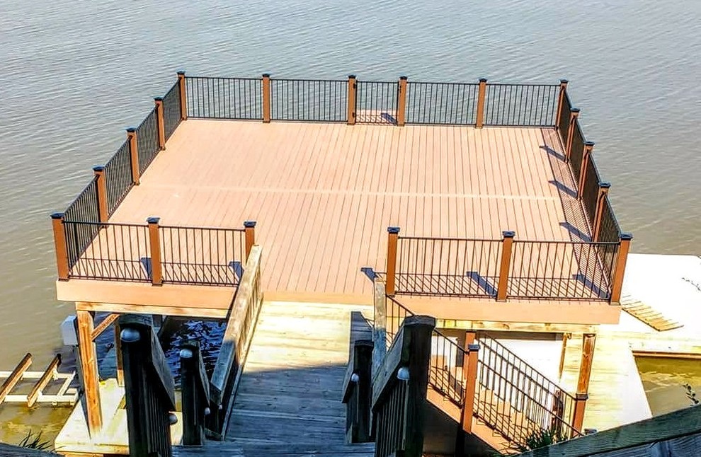 Photo of a mid-sized traditional rooftop deck in Other with with dock and no cover.