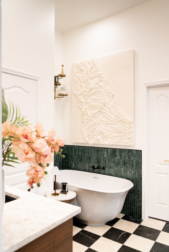 Freestanding bathtub - mid-sized transitional master marble floor and black floor freestanding bathtub idea in Austin with shaker cabinets, white walls, an undermount sink and a built-in vanity