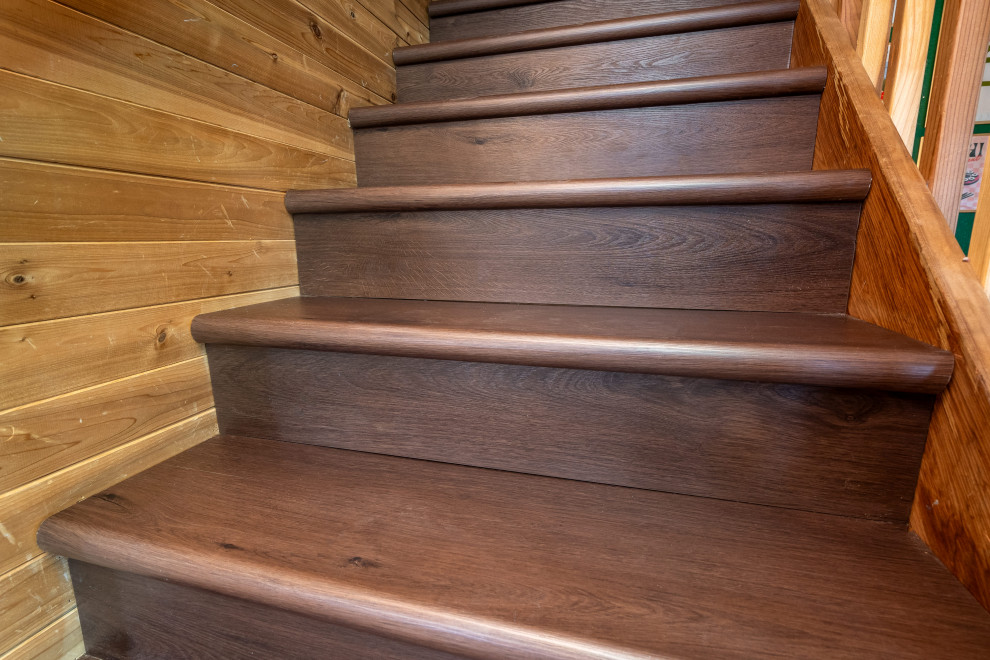 This is an example of a medium sized bohemian wood straight wood railing staircase in Sacramento with wood risers.