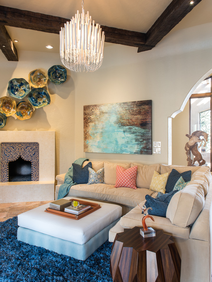 Inspiration for a large mediterranean open concept living room in Dallas with beige walls, travertine floors, a corner fireplace and a tile fireplace surround.