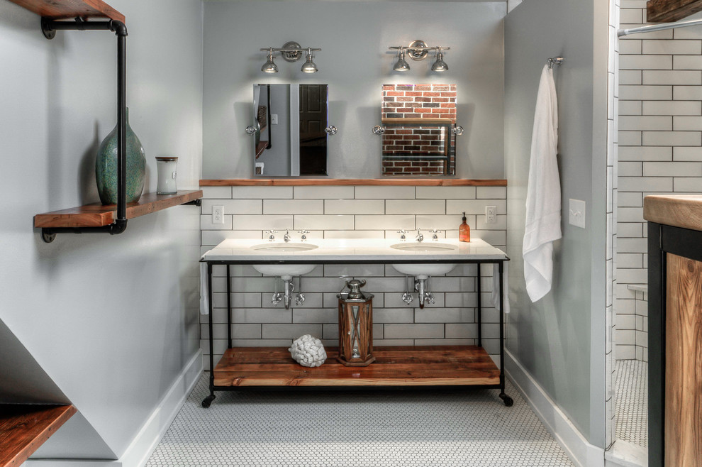 Design ideas for a large industrial master bathroom in Omaha with open cabinets, medium wood cabinets, an open shower, a one-piece toilet, white tile, subway tile, grey walls, mosaic tile floors, an undermount sink, marble benchtops and a shower curtain.