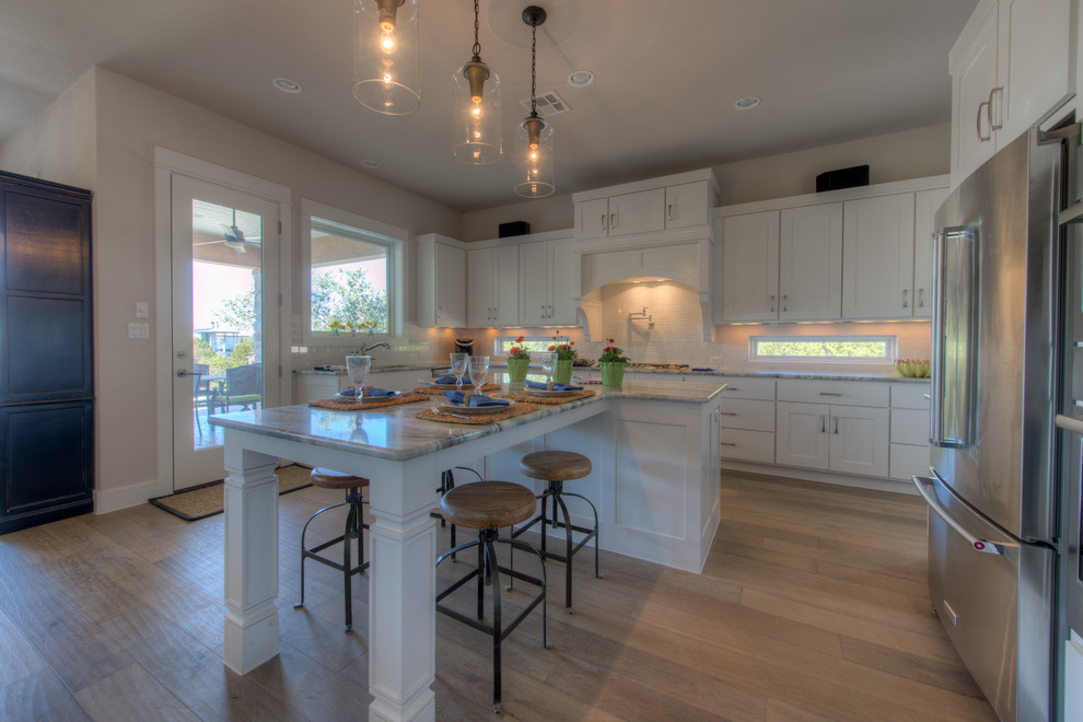 Eat-in kitchen - transitional eat-in kitchen idea in Austin with an island