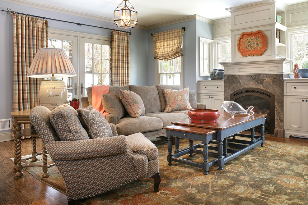 This is an example of a traditional living room in New York with blue walls.